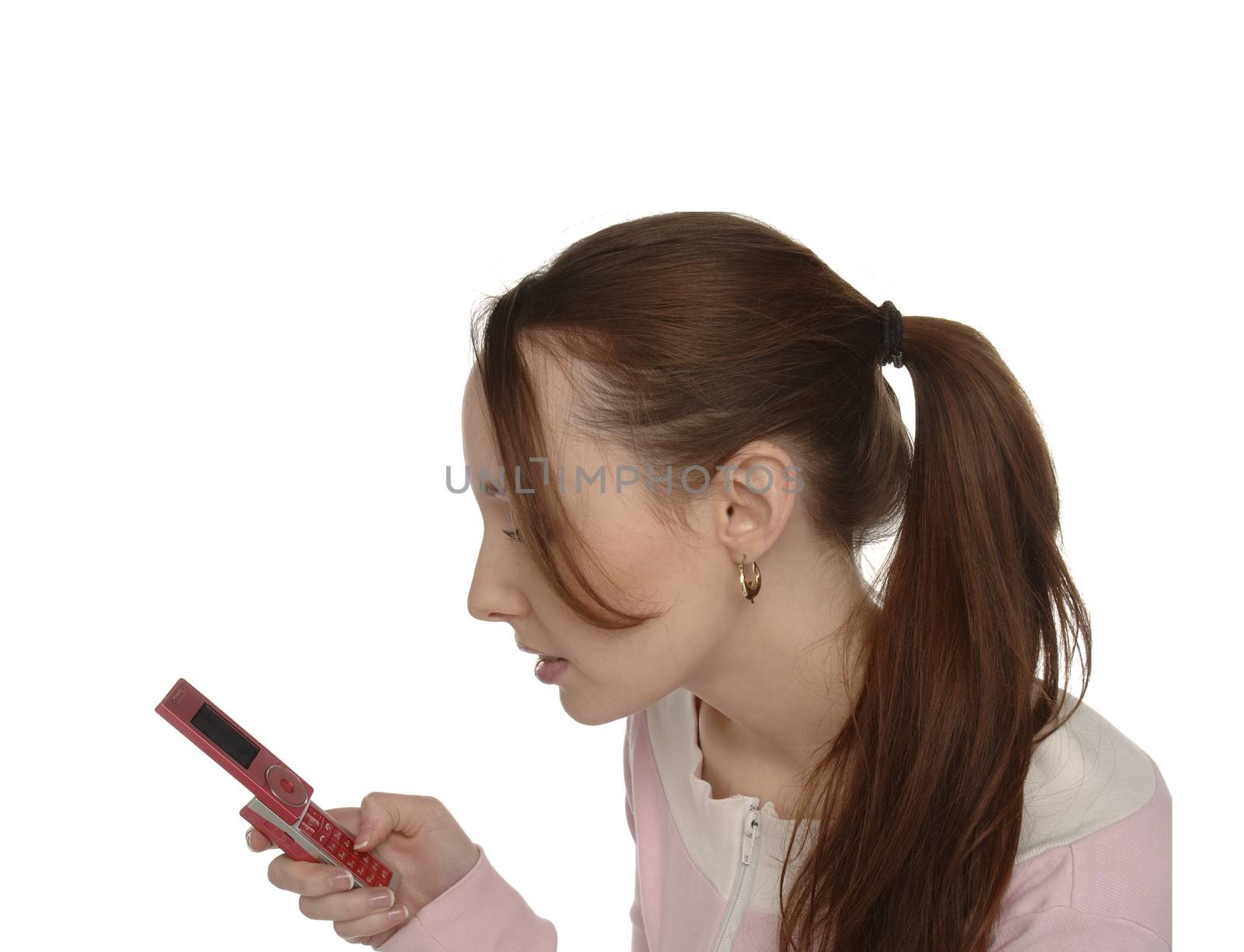 A girl with ponytail texting on her mobile