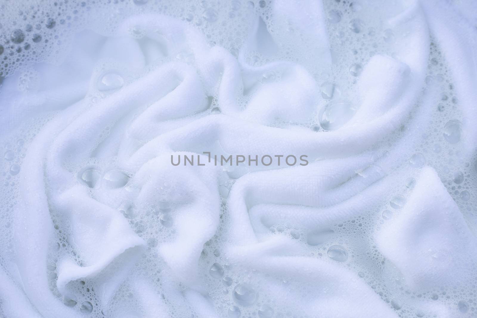 Soak a cloth before washing, white cloth