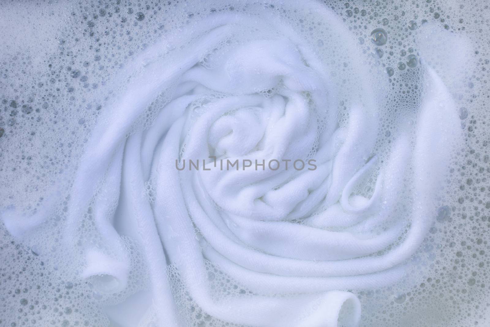 Soak a cloth before washing, white cloth