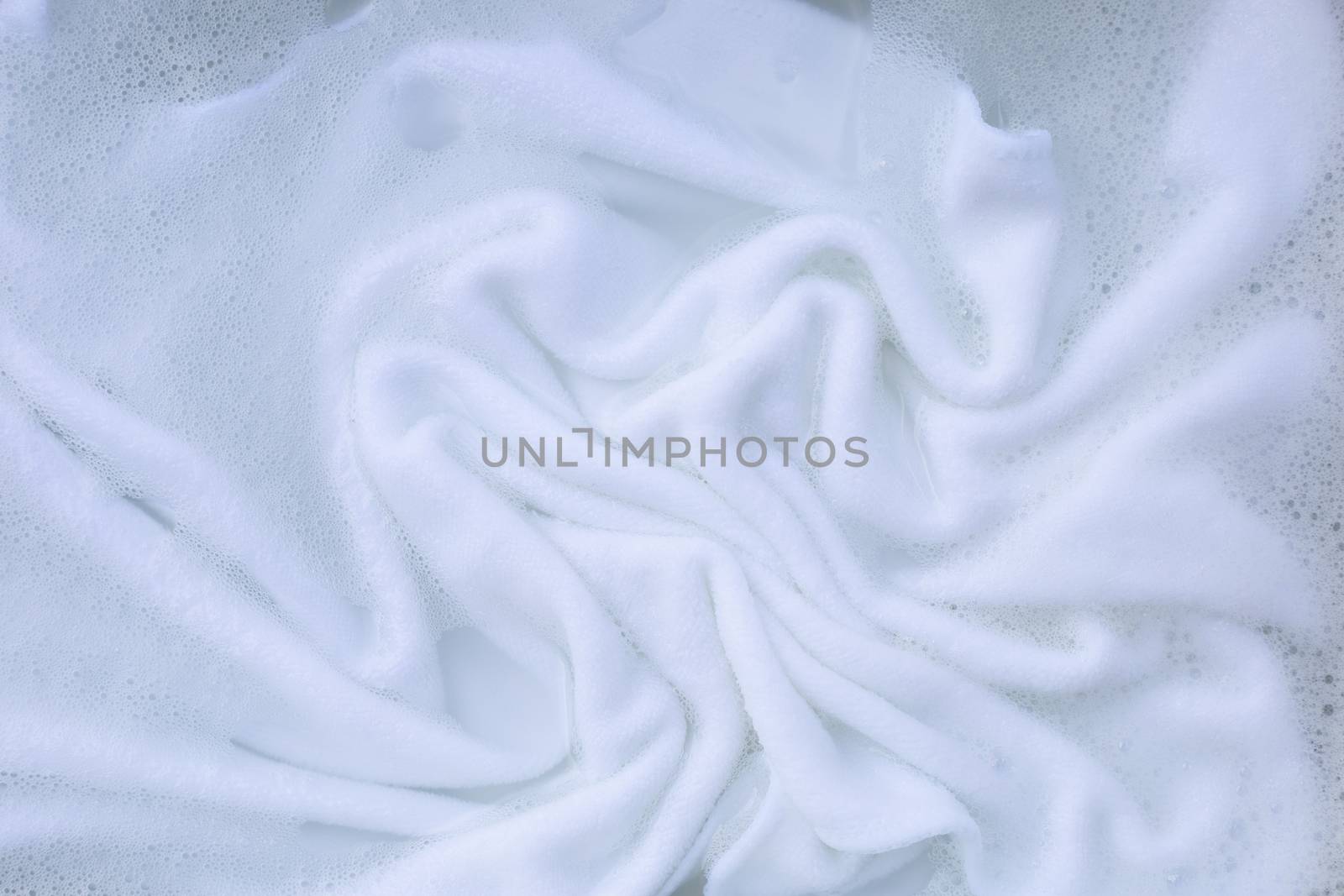 Soak a cloth before washing, white cloth