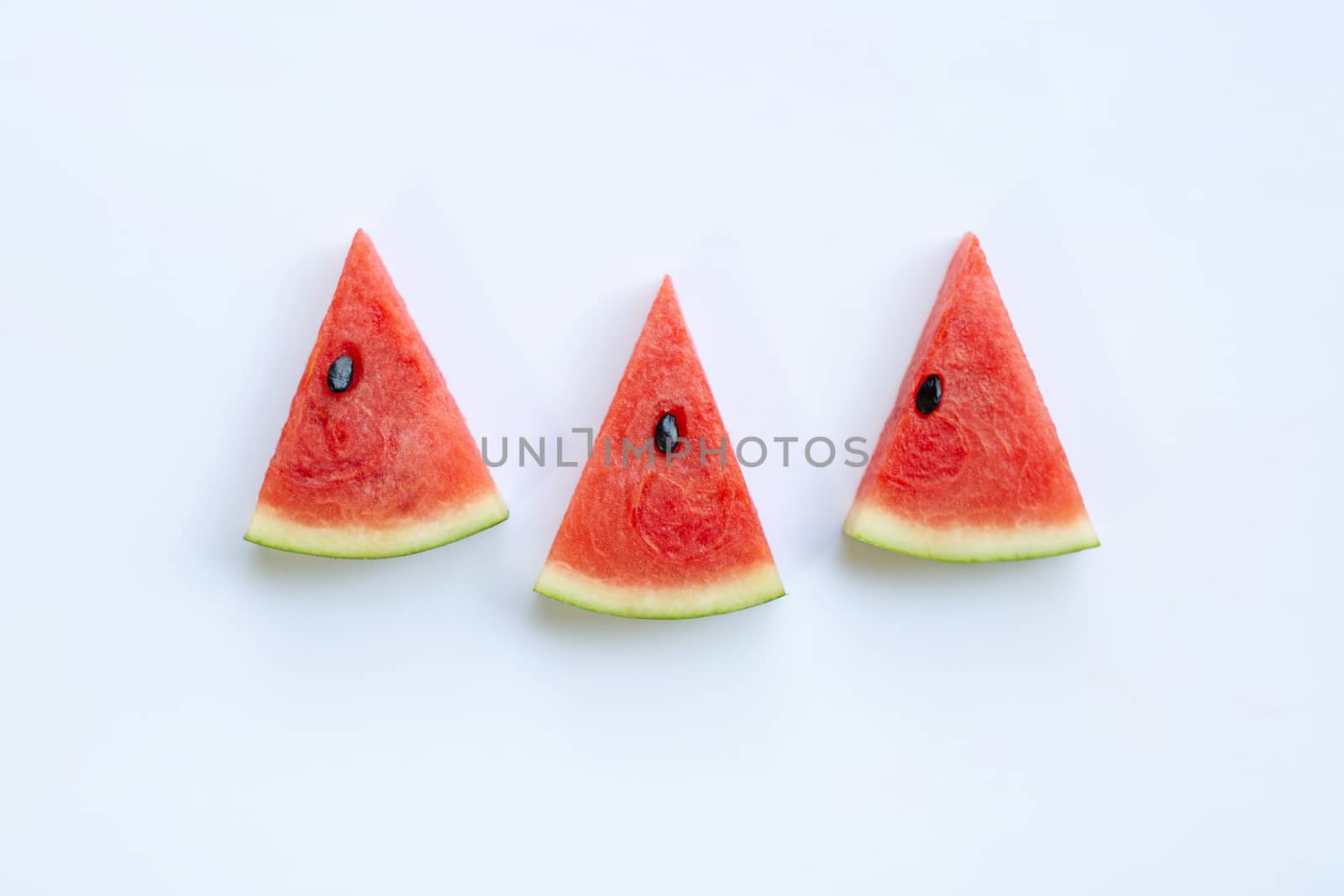 Sweet watermelon slices on white background