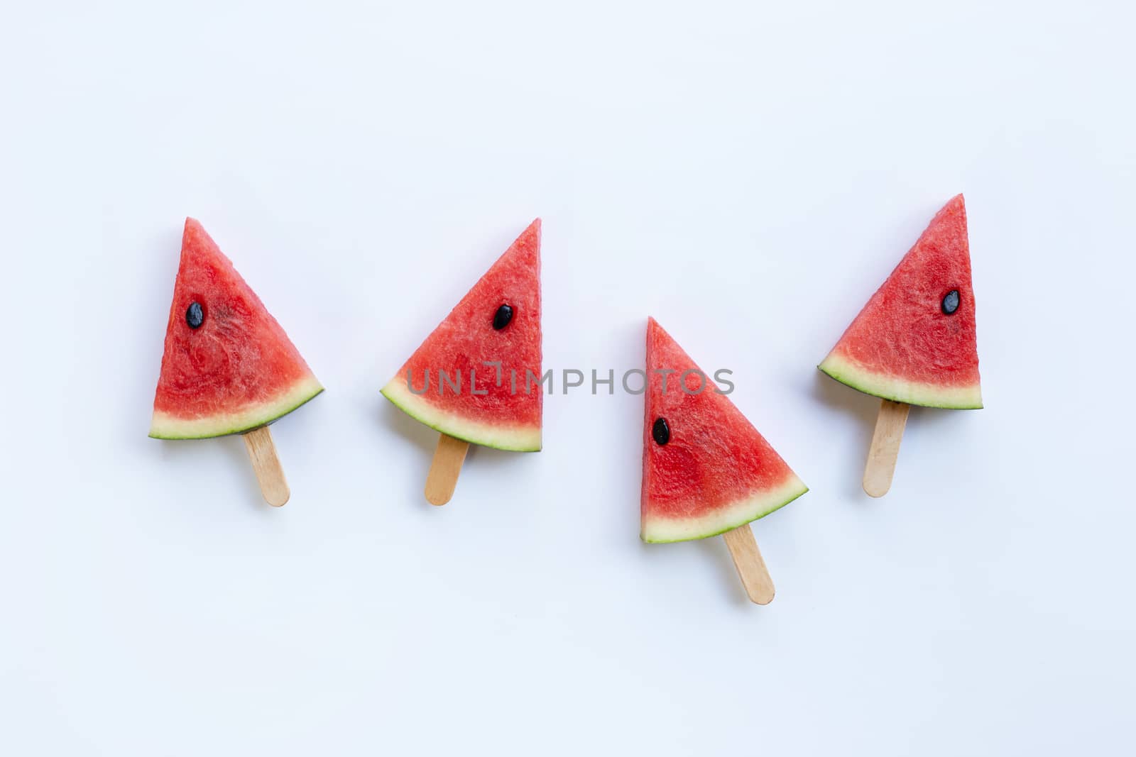 Sweet watermelon slice popsicles on white background