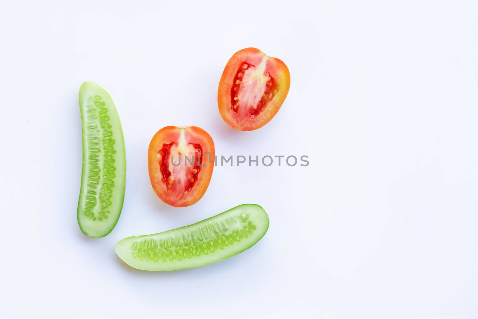 Cucumber, Tomato, Natural ingredients for homemade skin care on white.