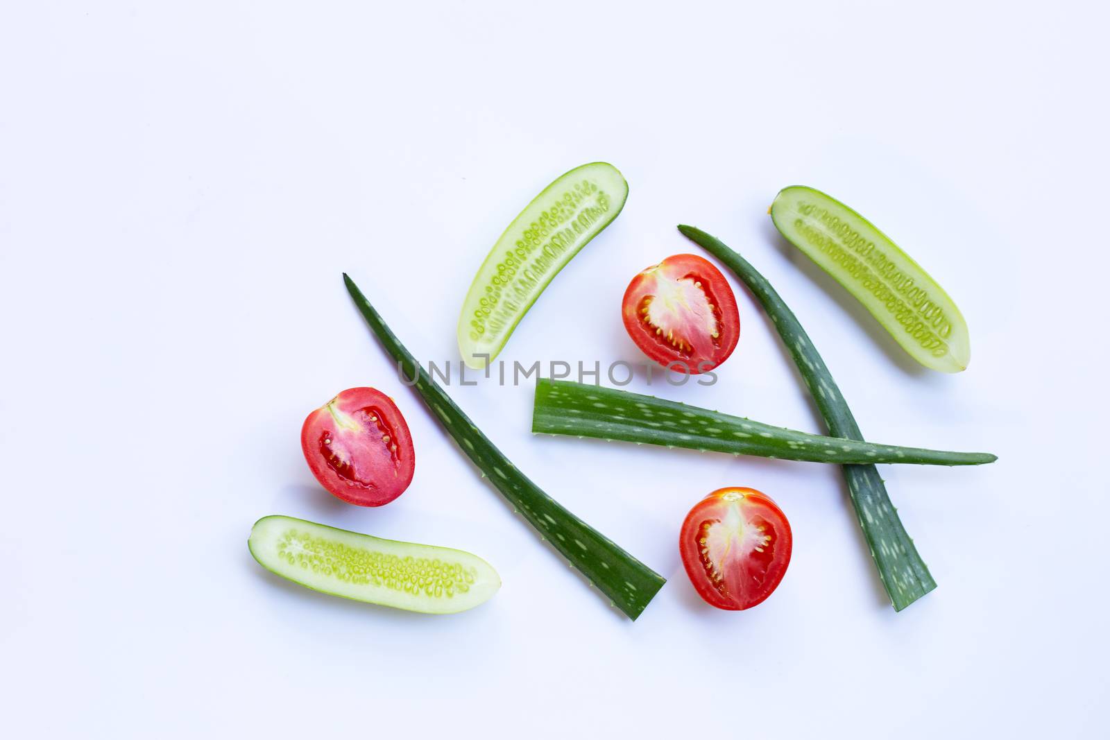 Tomatoes, Cucumbers, Aloe vera, Natural ingredients for homemade skin care on white.