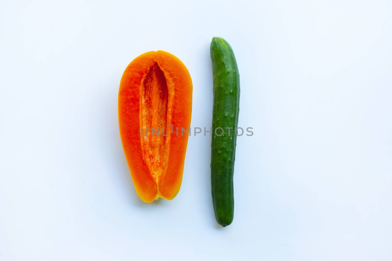 Cucumber and papaya  on white background. Sex concept.