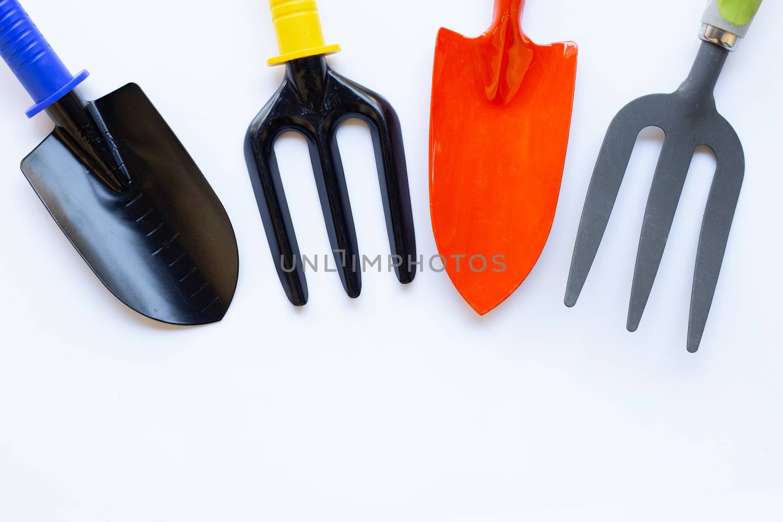 Garden shovel and fork isolated on white background