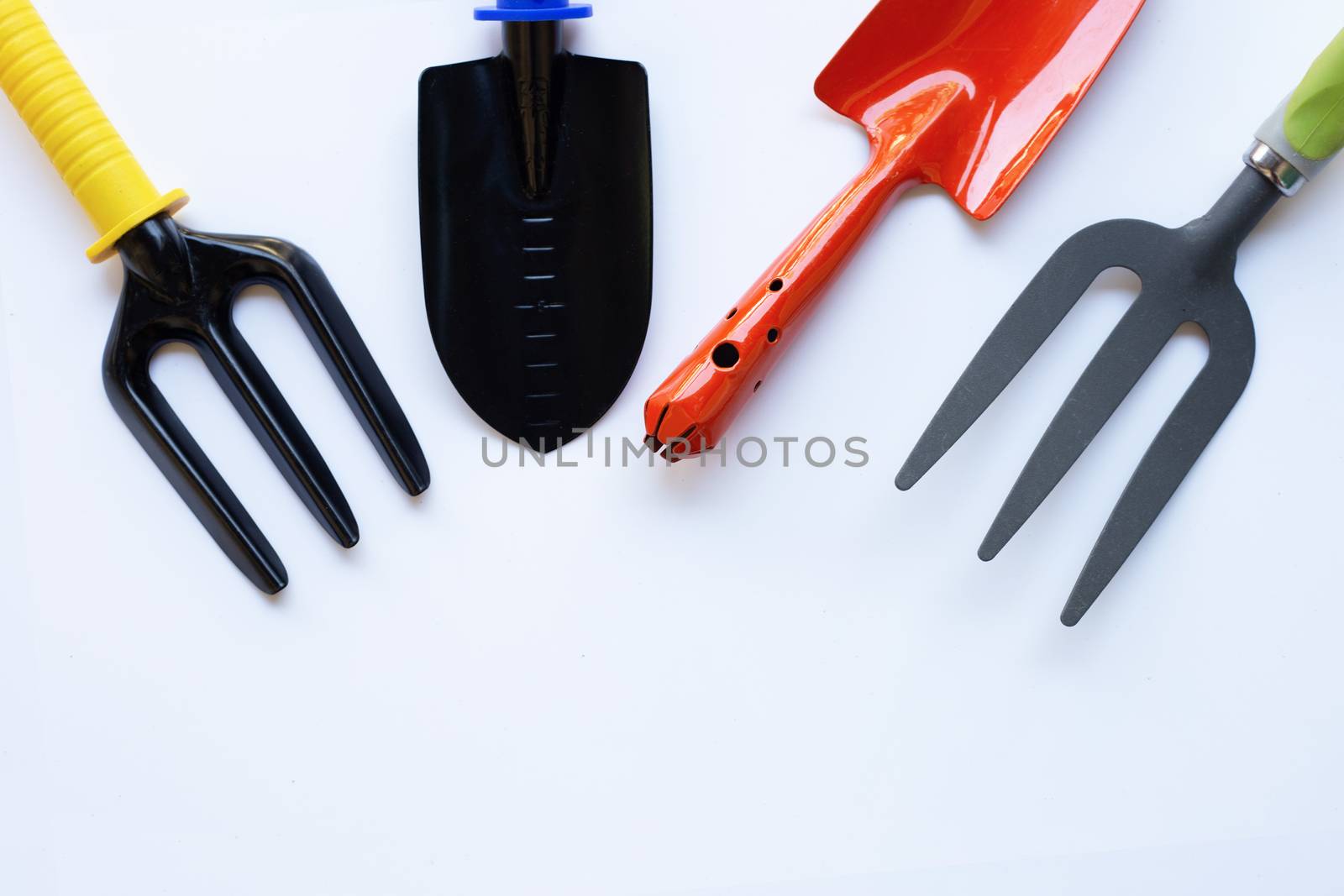 Garden shovel and fork isolated on white background