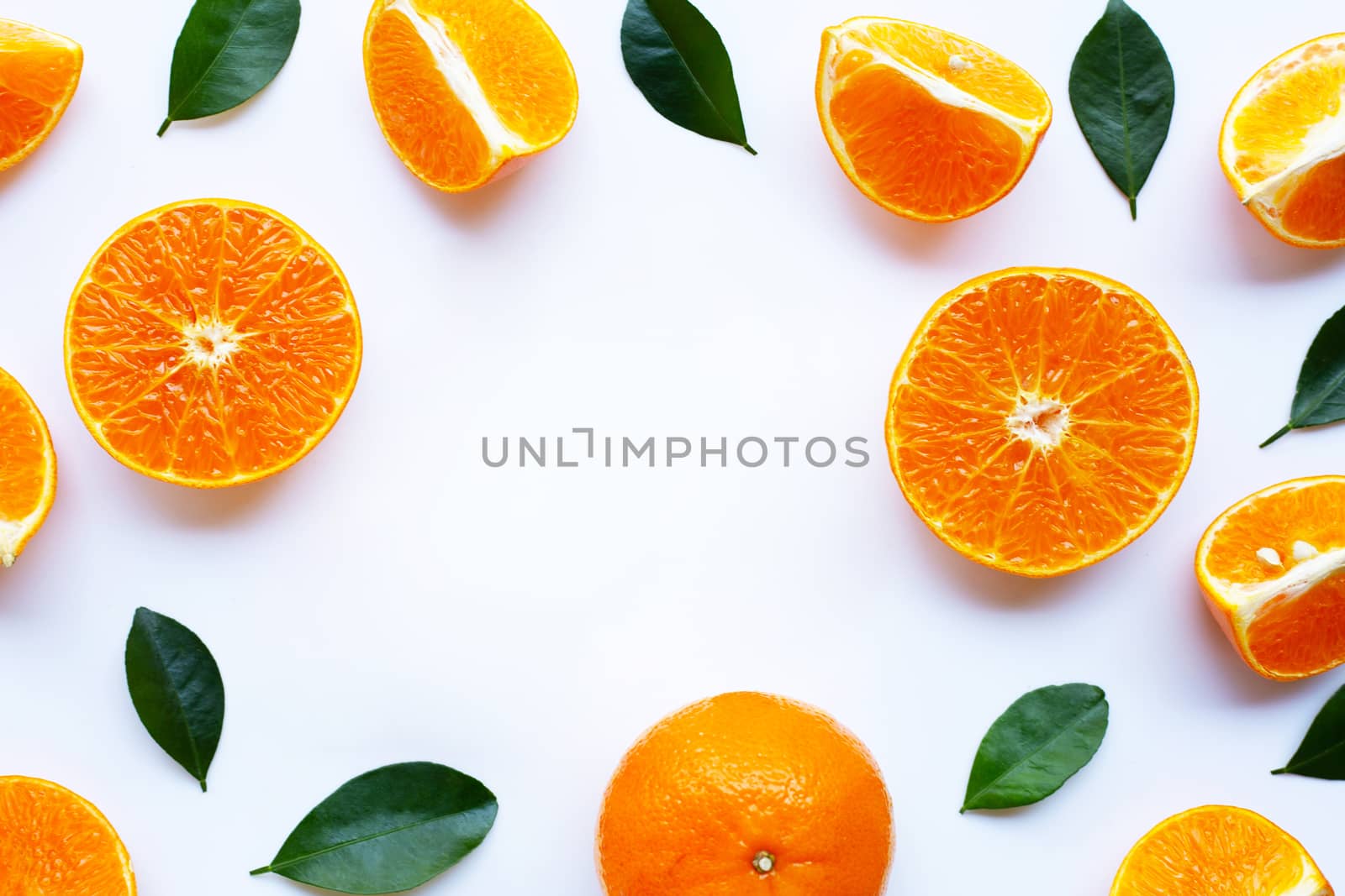 Fresh orange with green leaves isolated on white background. Copy space