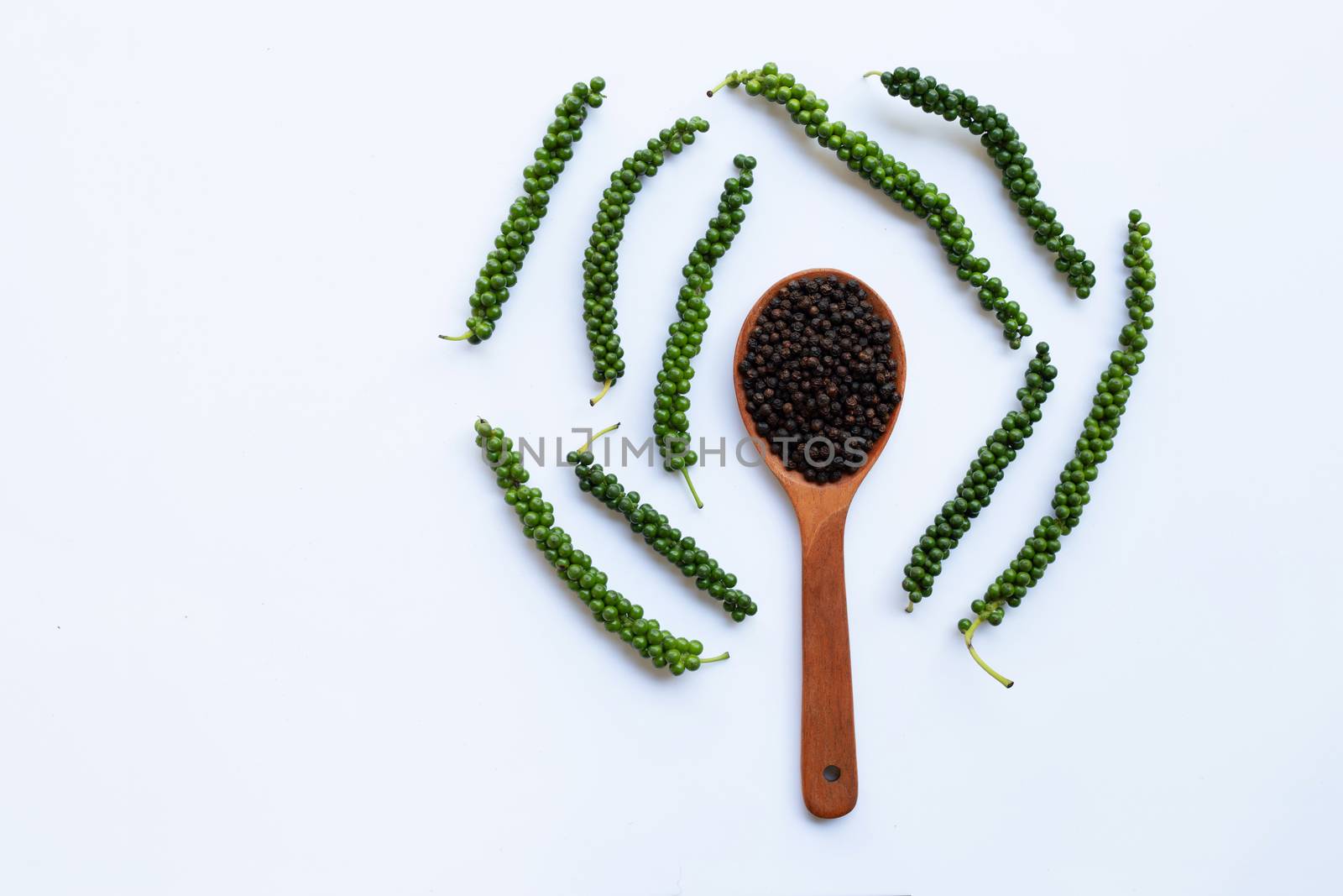 Fresh green peper with Black Pepper on white background.