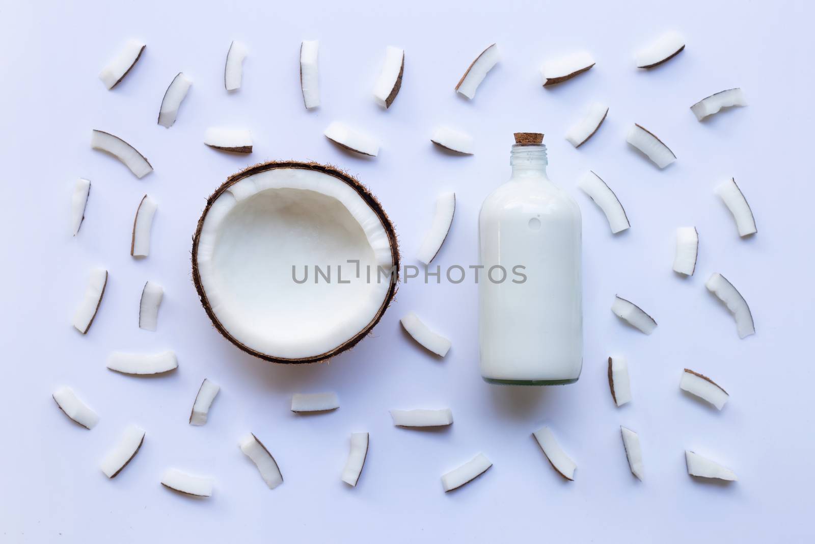Coconut and coconut milk on white background.