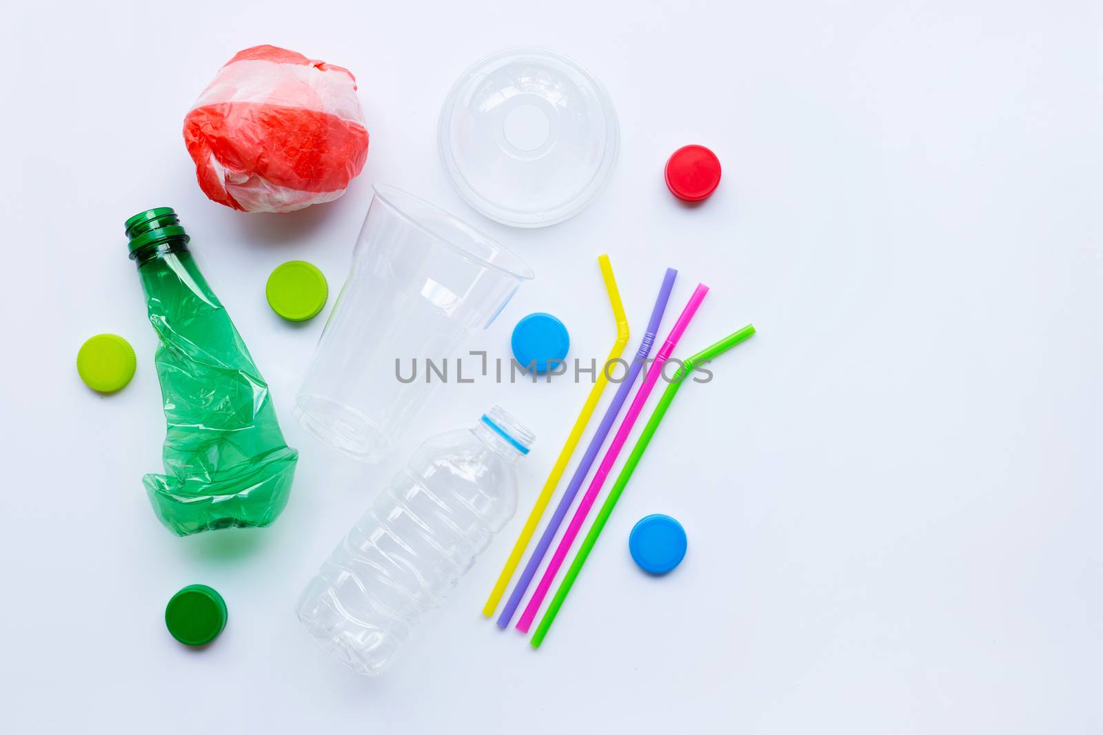 Plastic waste on white background. Top view, Copy space