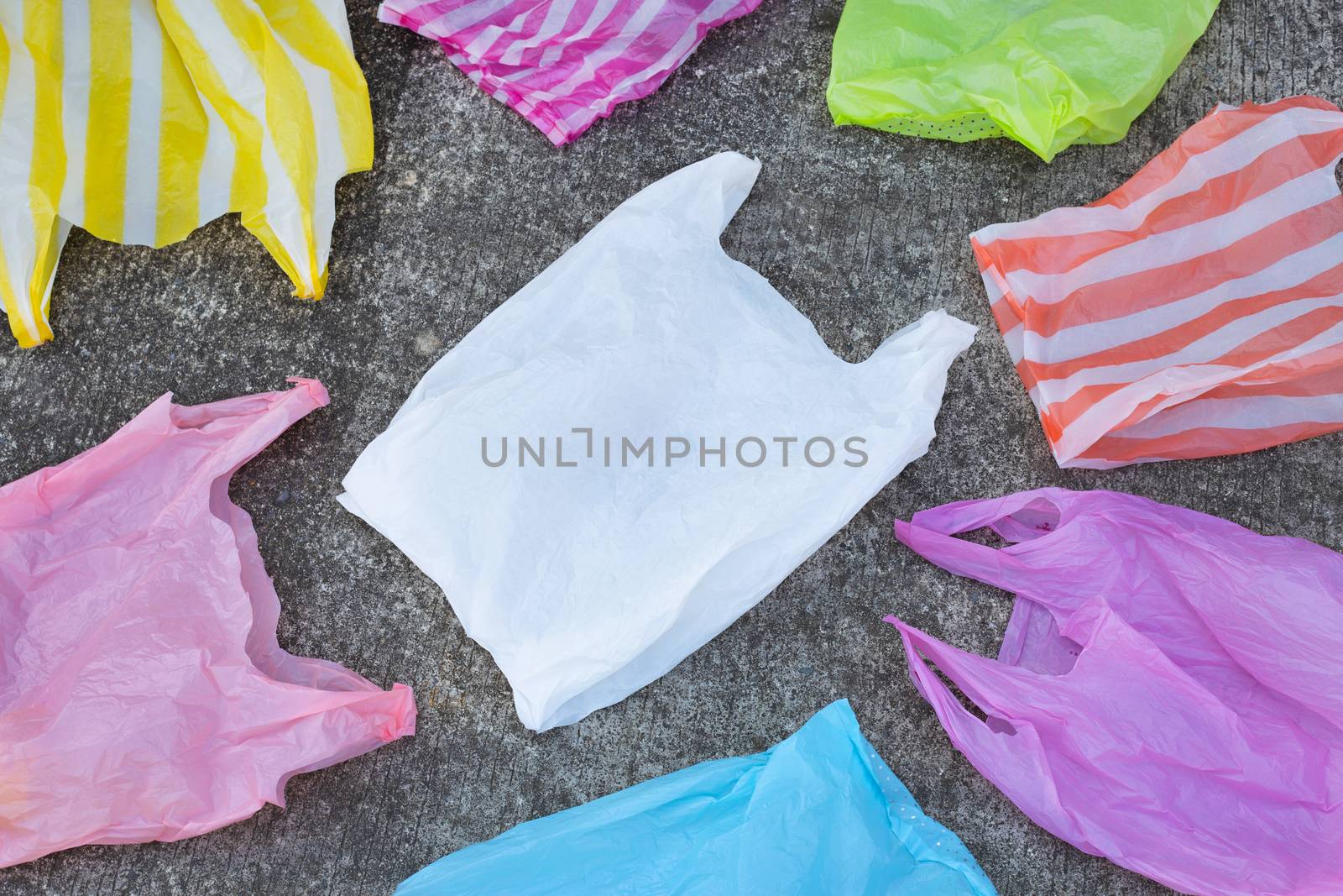 Plastic garbage bags on cement floor. Top view
