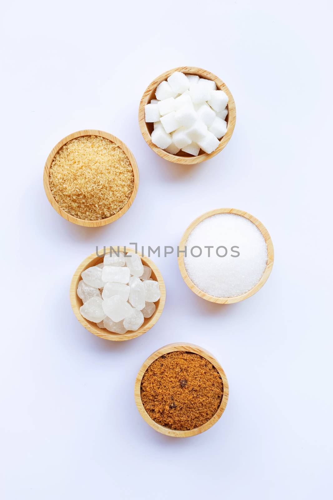 Various types of sugar on white. by Bowonpat