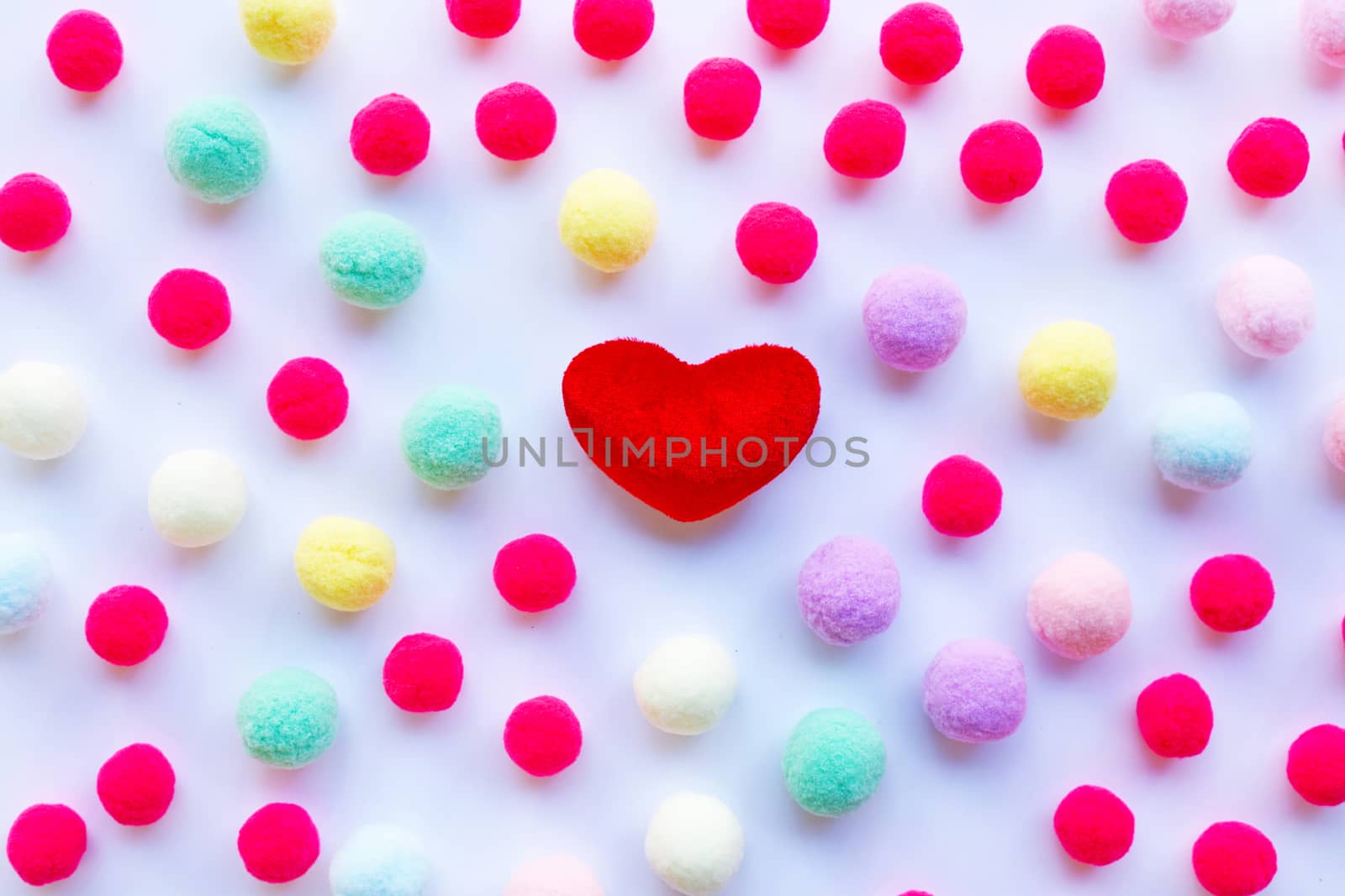 Red heart, little colorful balls . Concept of Valentines Day on white background
