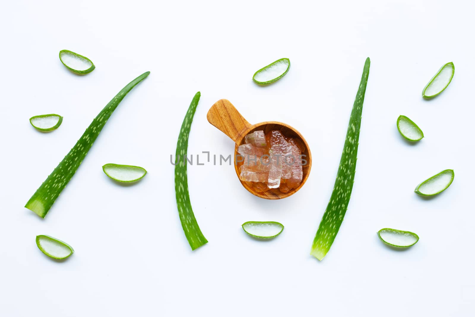 Aloe vera slices on white background.