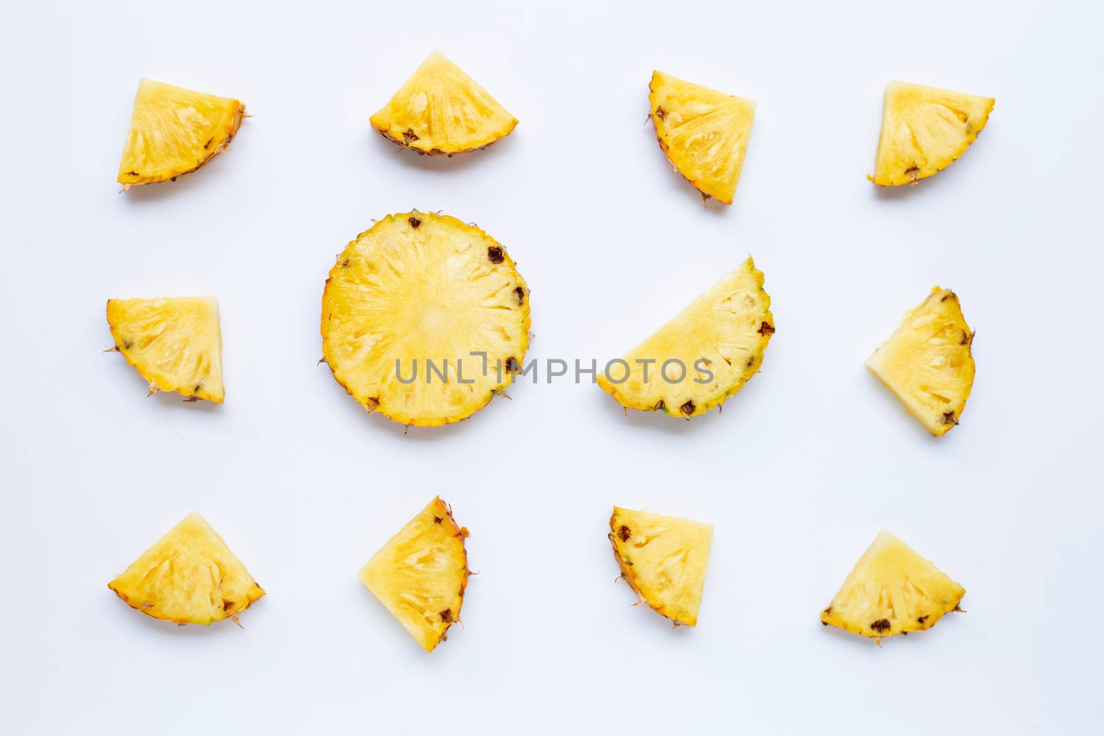 Pineapple slices on white background.
