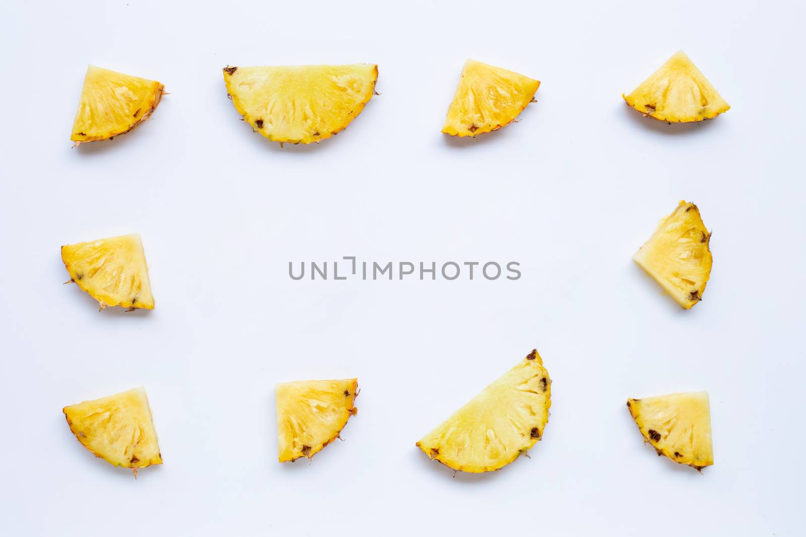 Pineapple slices on white background. Copy space