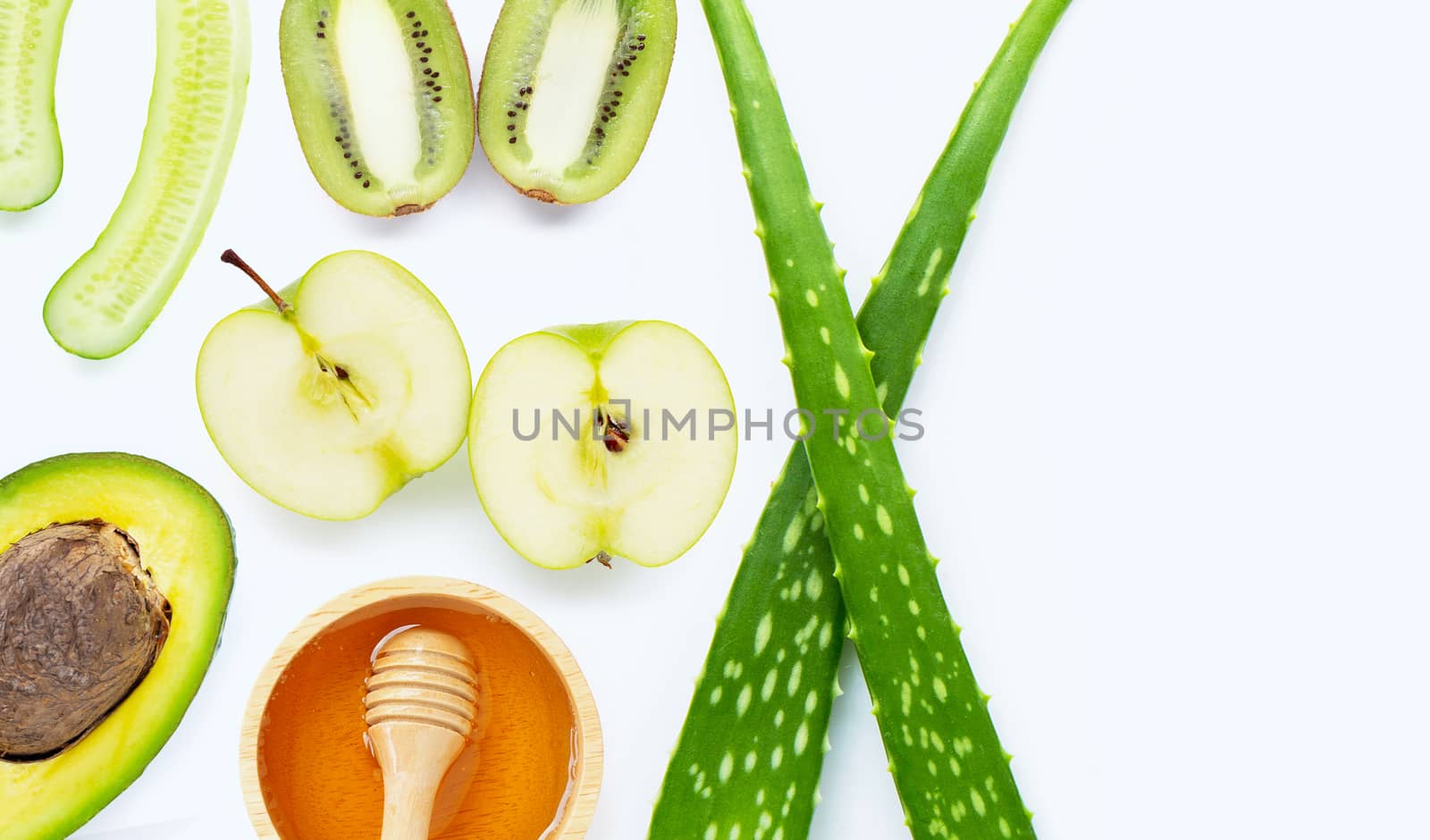 Natural ingredients for homemade skin care on white background.