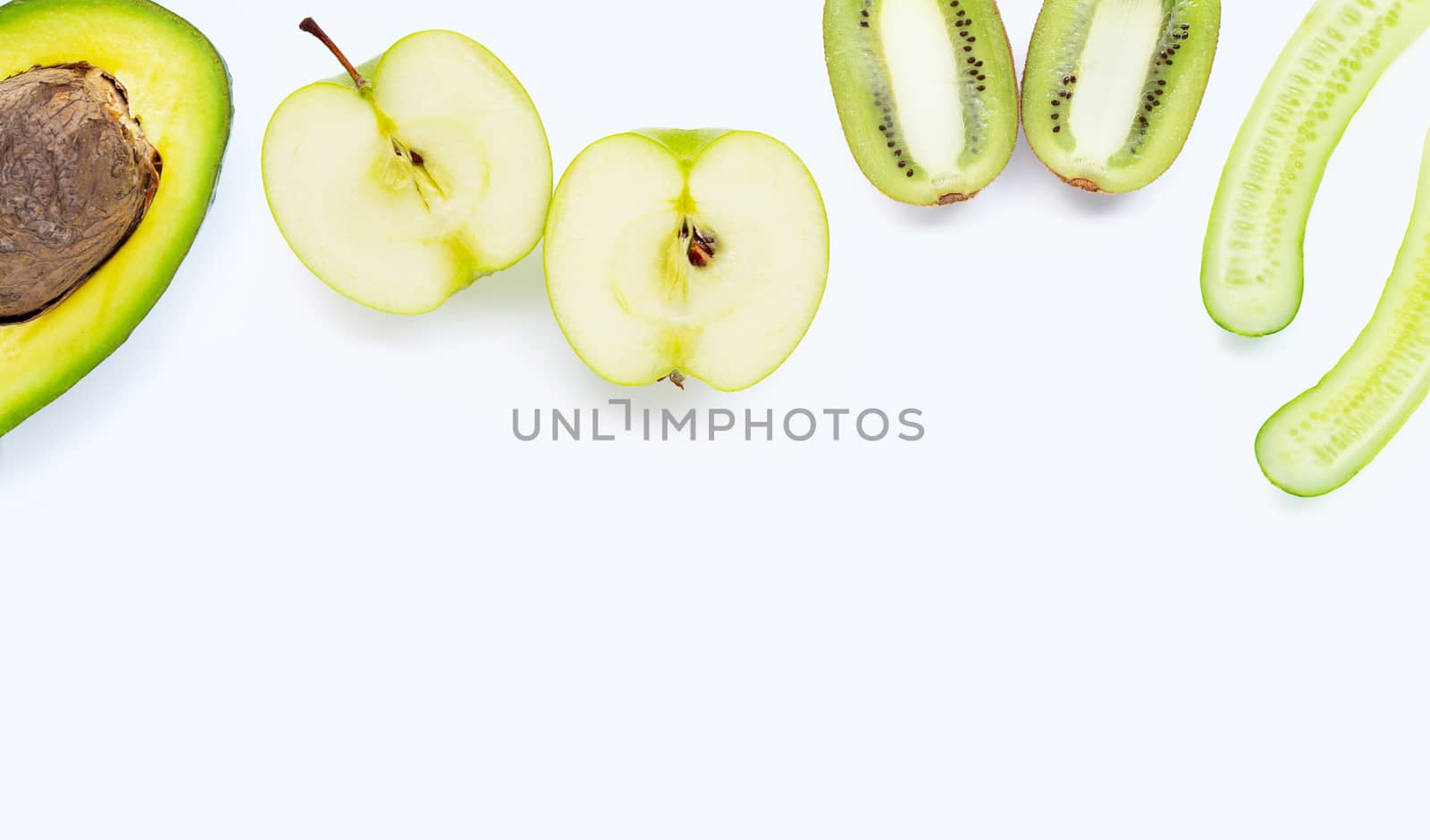 Avocado, green apple, kiwi, cucumber. Natural ingredients for homemade skin care on white background. Copy space