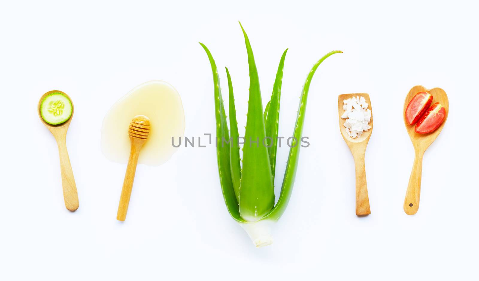 Natural ingredients for homemade skin care on white background.