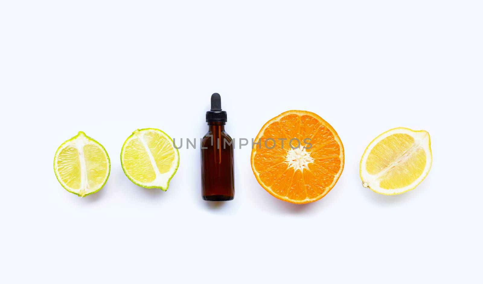 Essential oil with citrus tropical fruit isolated on white background