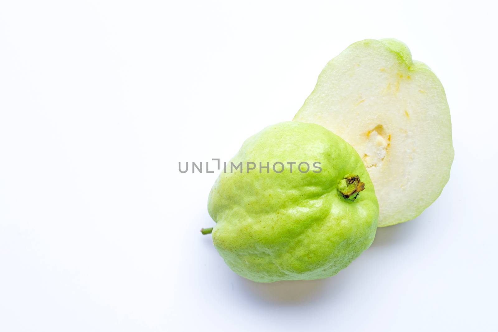 Guava on white background.  Copy space
