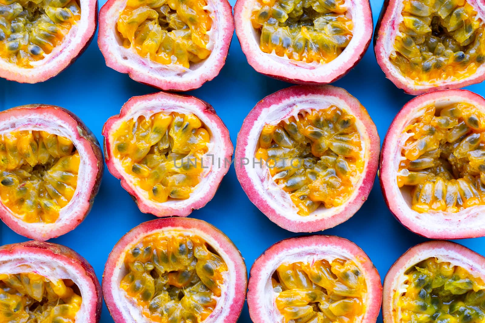 Passion fruit on blue background. Top view