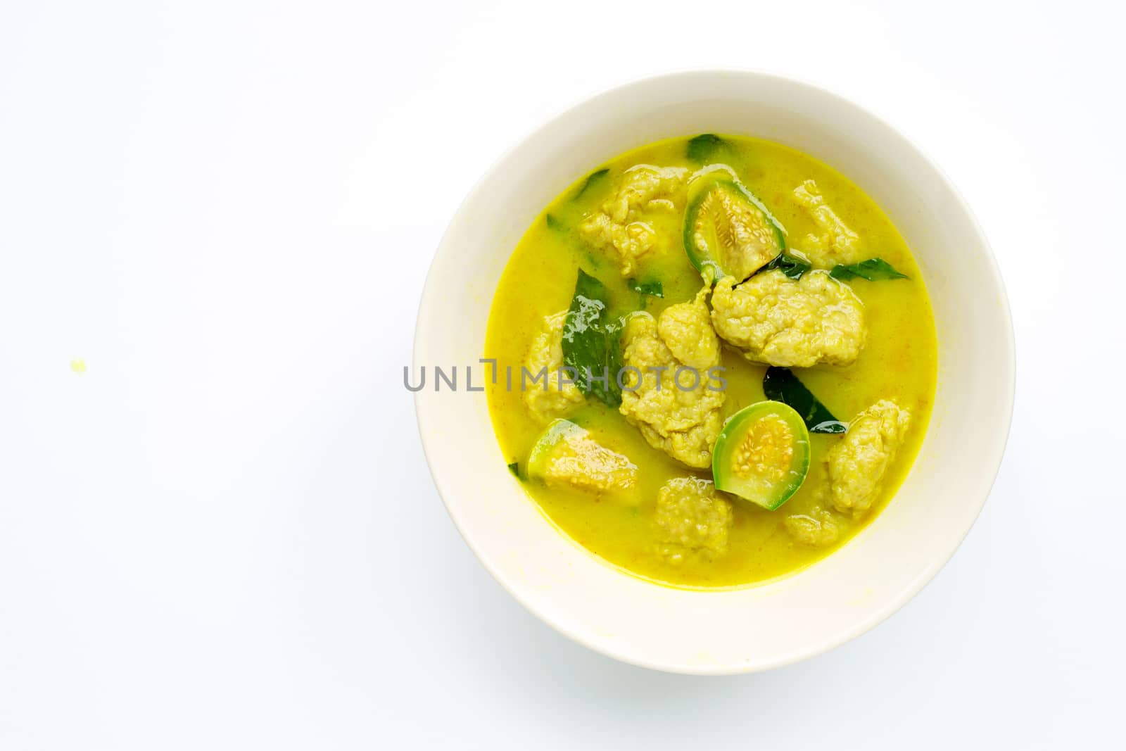 Thai food, Green Curry with fish ball on white background. Copy space