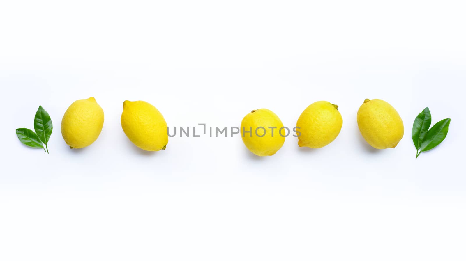 Fresh lemon with green leaves on white background. Copy space for text or product