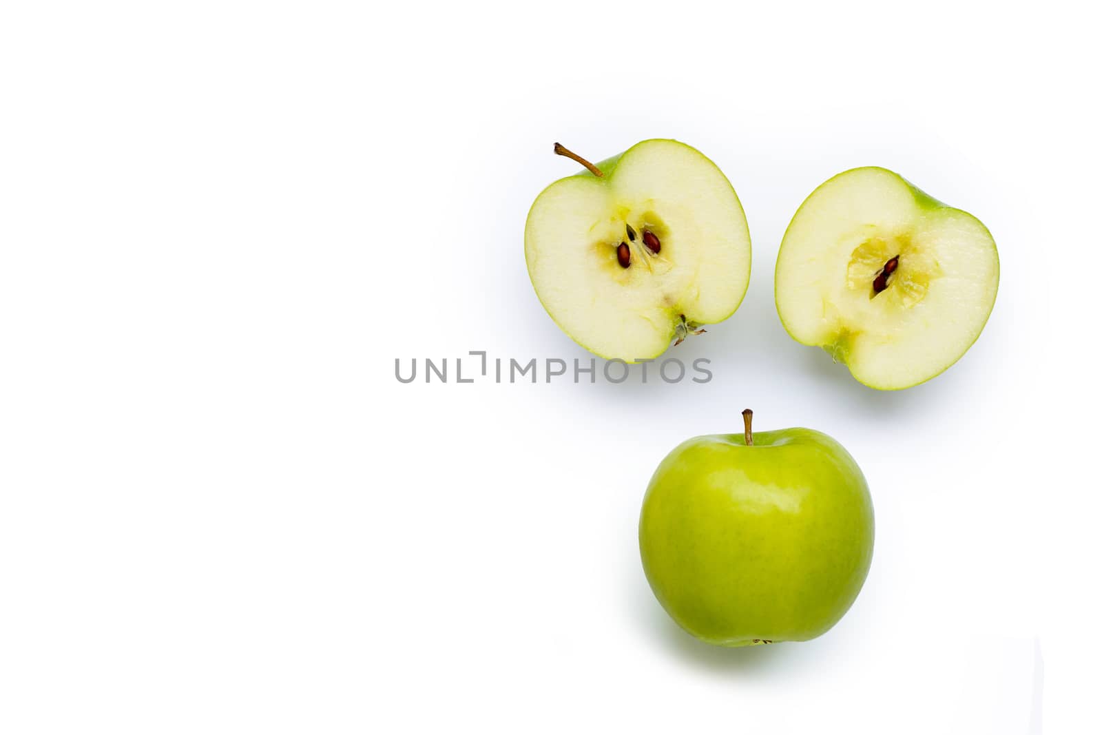 Green apples on white background. Copy space