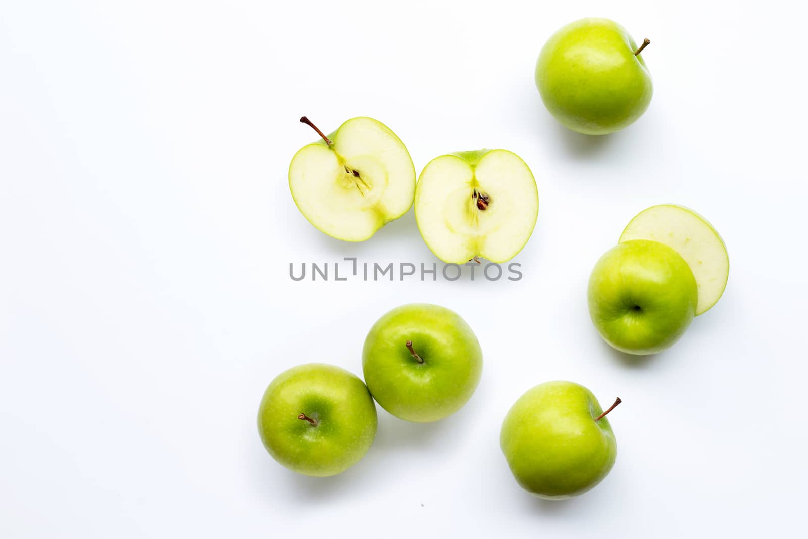 Green apples on white background. Copy space