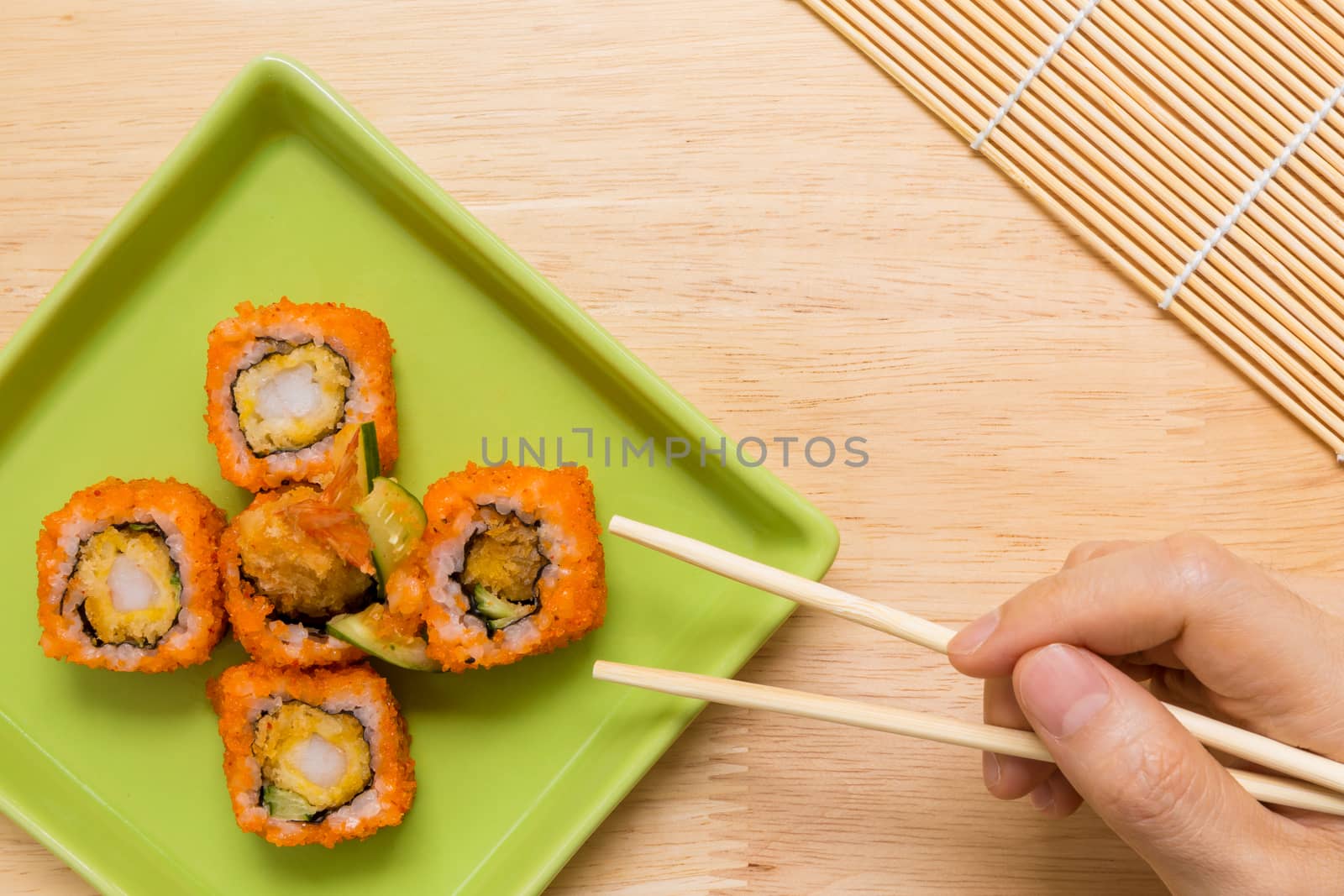 Traditional Japanese food, sushi roll, on wooden background