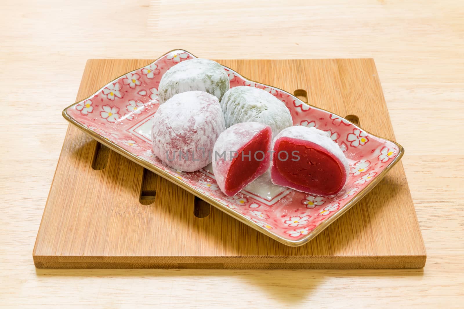 Daifuku traditional Japanese dessert eaten with tea background.