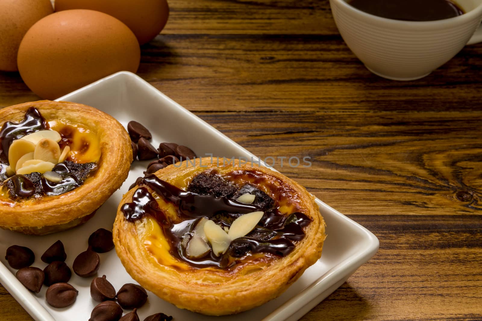 Traditional Portuguese egg tart to be eaten with coffee.