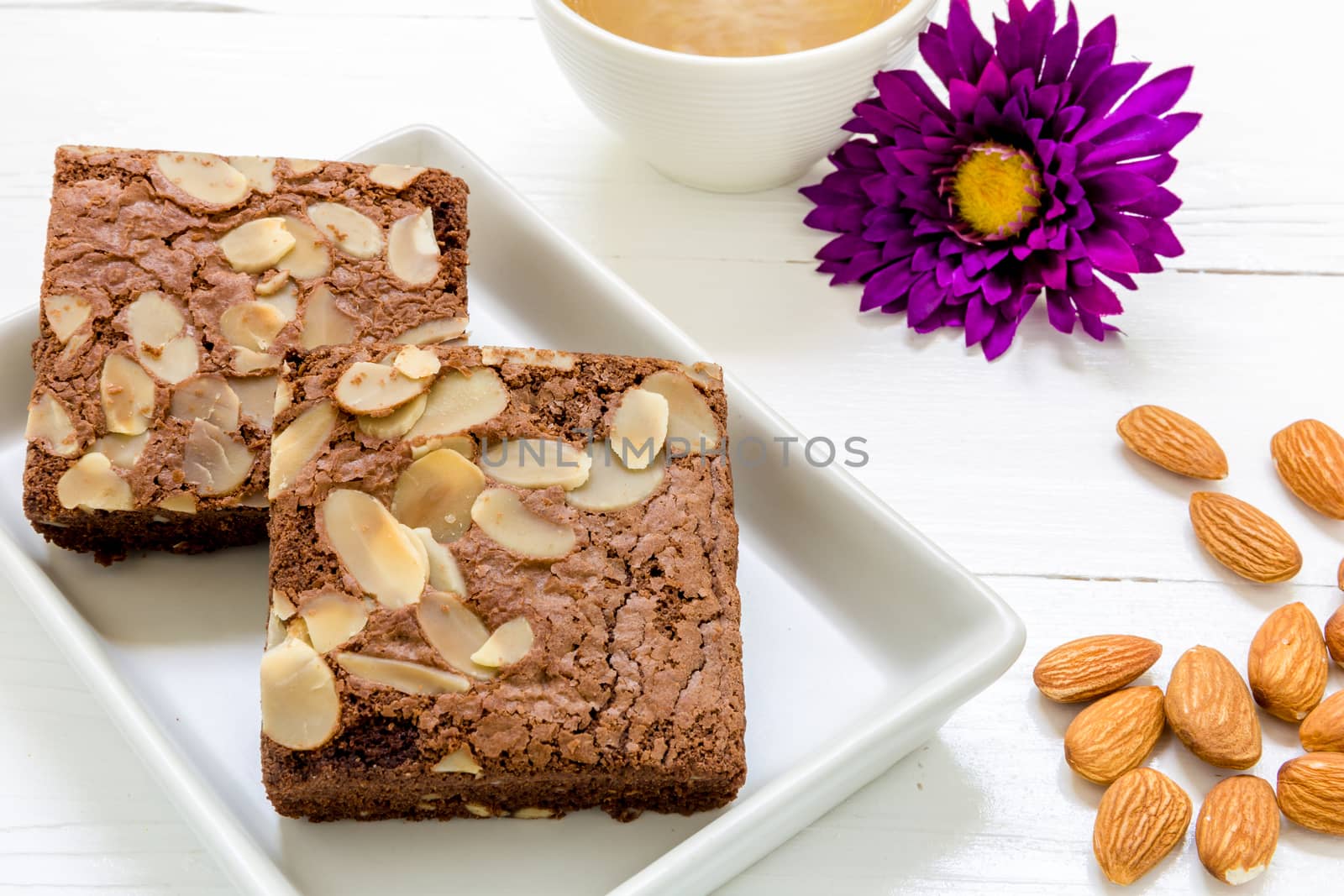 Chocolate almond brownie for relaxing coffee break.