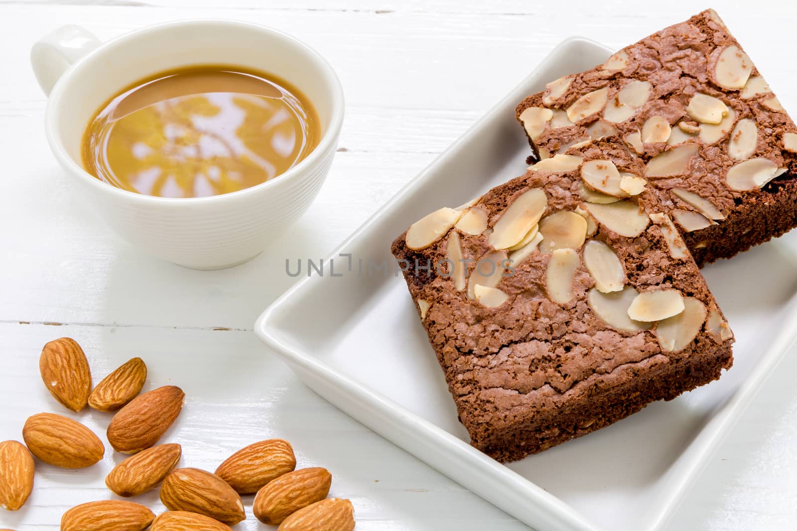 Chocolate almond brownie for relaxing coffee break.