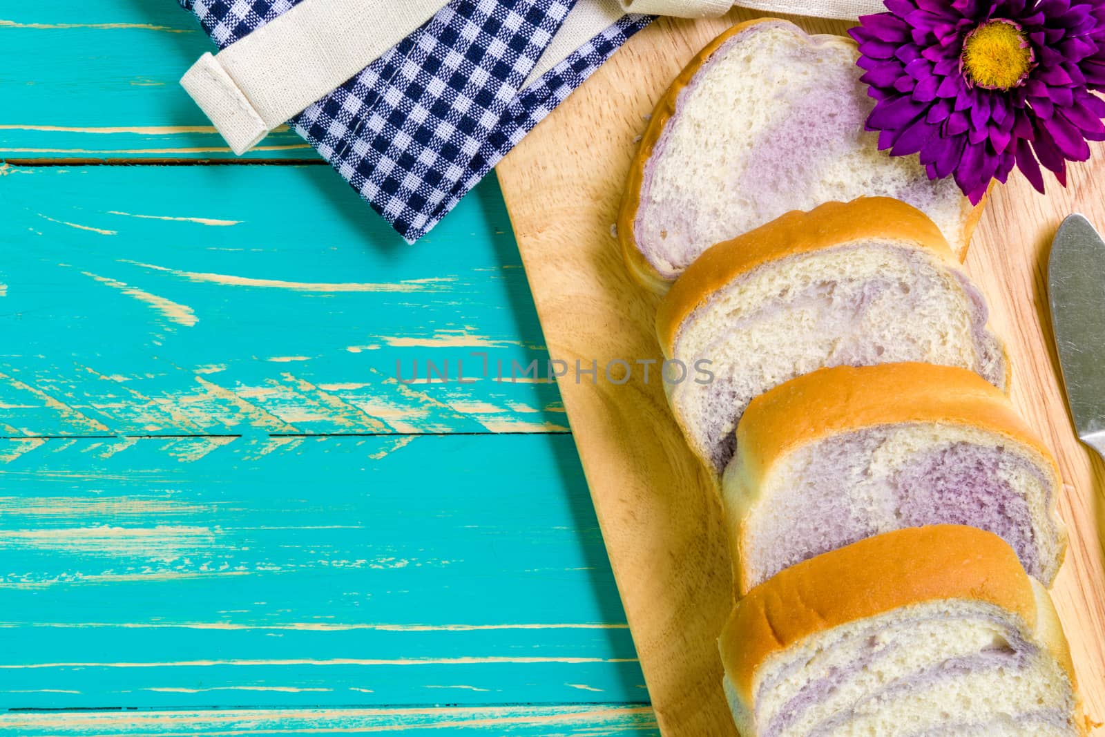 Taro bread for breakfast on vintage wooden background.