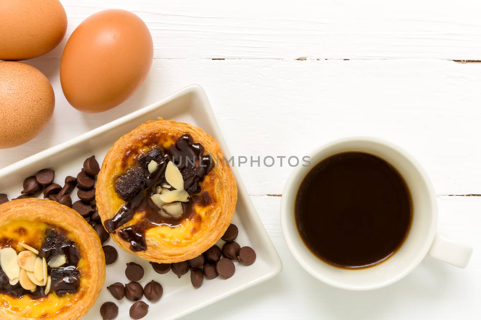 Traditional Portuguese egg tart to be eaten with coffee.