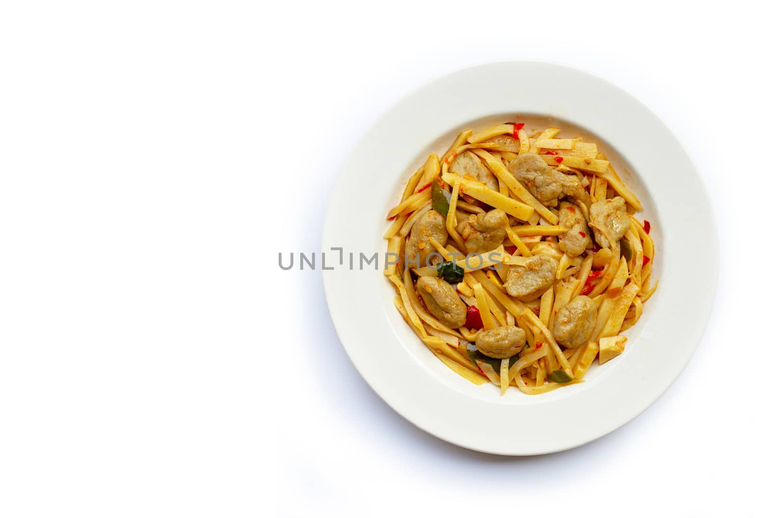 Spicy preserved bamboo shoot stir fried recipe with fish ball on white background. Copy space