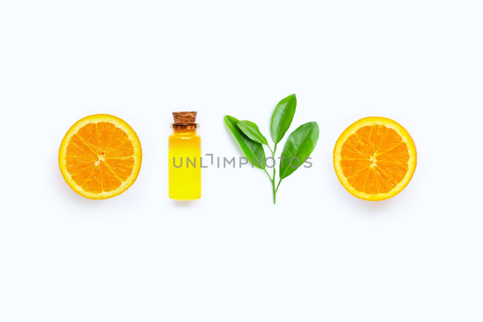 Natural citrus oil with fresh orange fruit and green leaves  on white background. High vitamin C. Top view