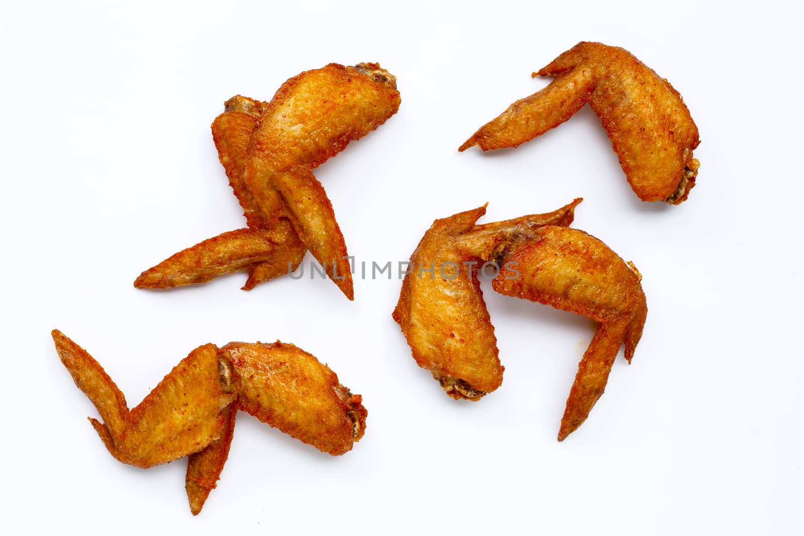 Fried chicken wings on white background.  Copy space