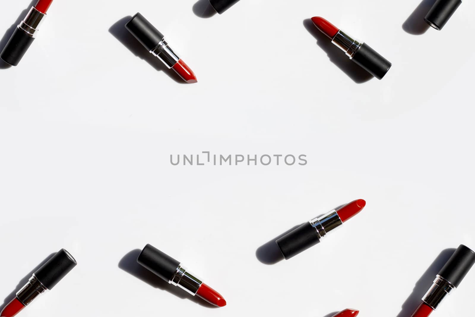 Flat lay composition, Lipsticks on white background with shadow. Beautiful Make-up concept