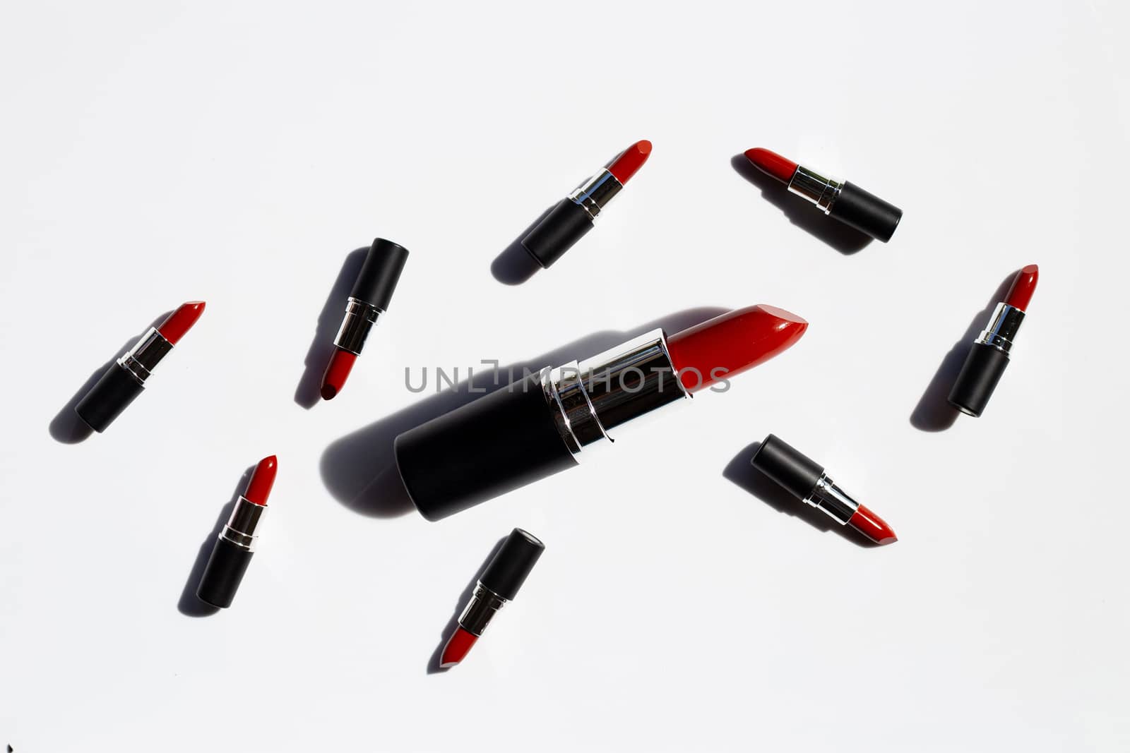 Flat lay composition, Lipsticks on white background with shadow. Beautiful Make-up concept