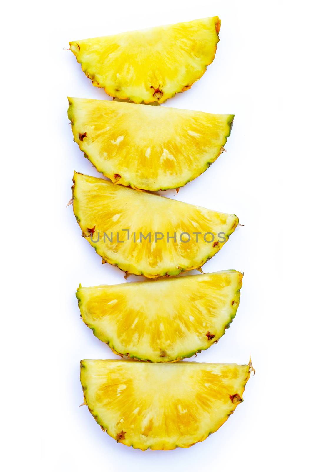 Fresh pineapple slices on white background. Top view