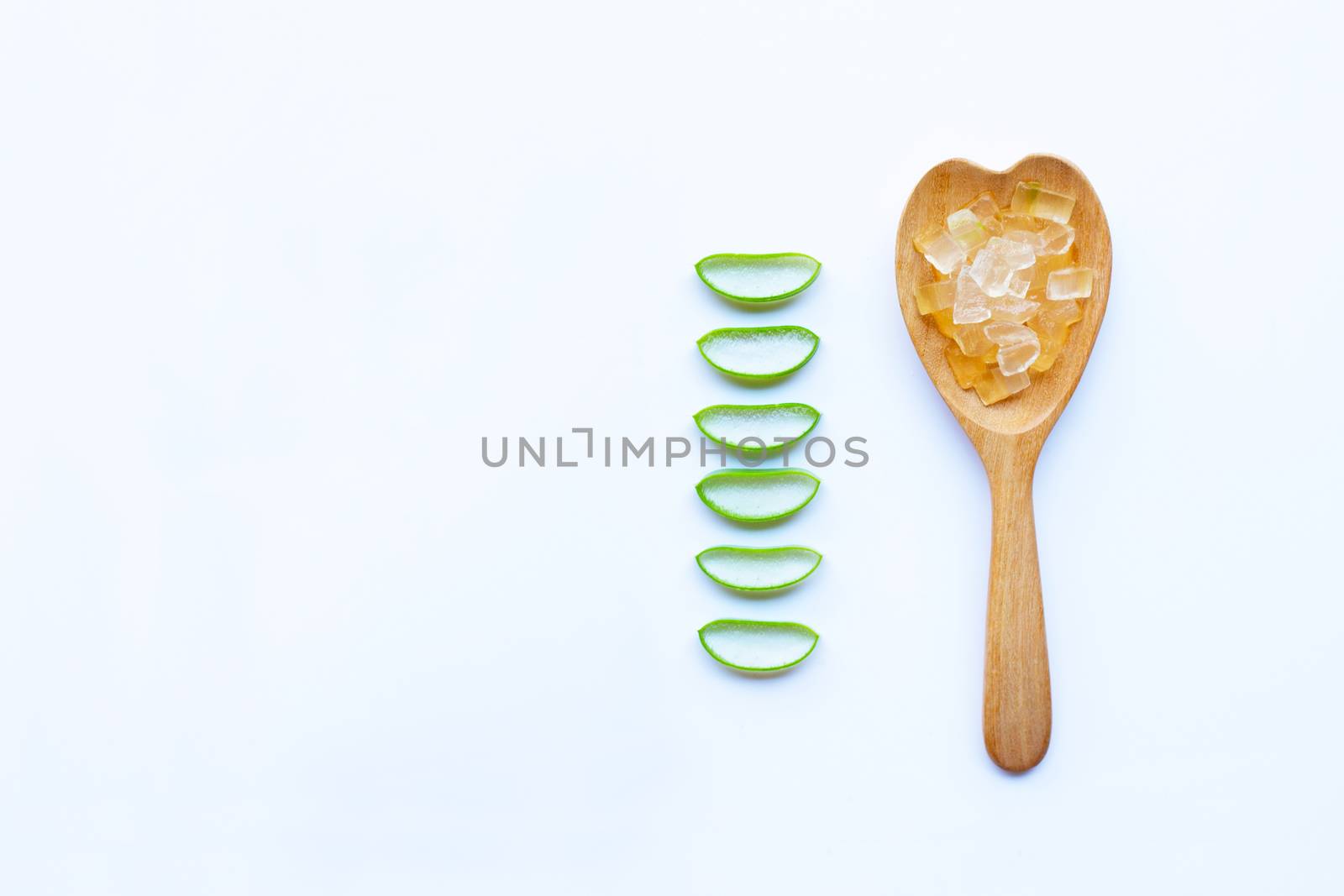 Aloe vera fresh leaves slices with aloe vera gel on white background. copy space