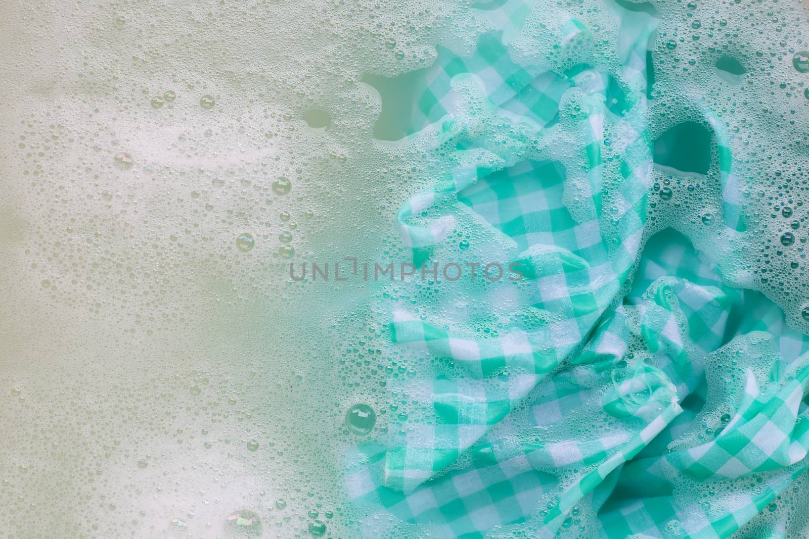 Soak a green white tablecloth before washing