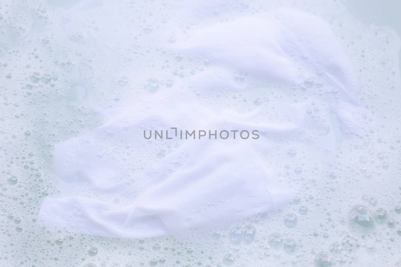 Soak a cloth before washing, white cloth