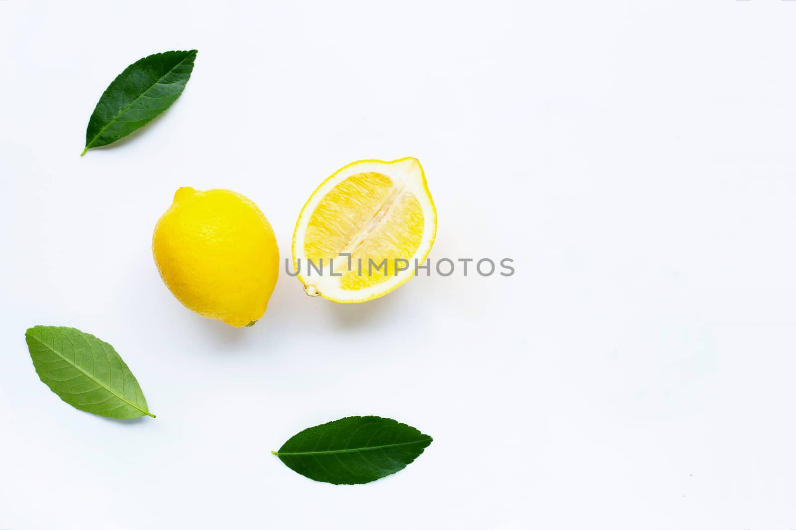 Fresh lemon on a white background. Copy space