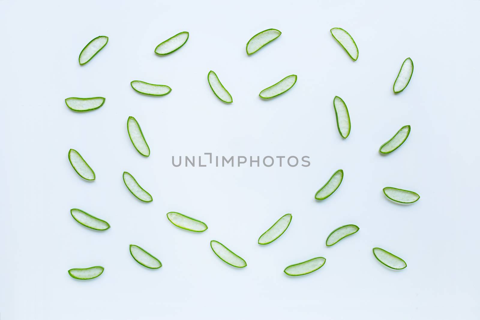 Aloe vera slices on white background. Aloe vera is a popular medicinal plant that is used for health and beauty.