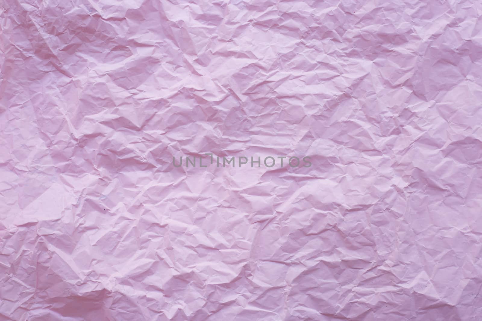 Pink crumpled recycle paper background